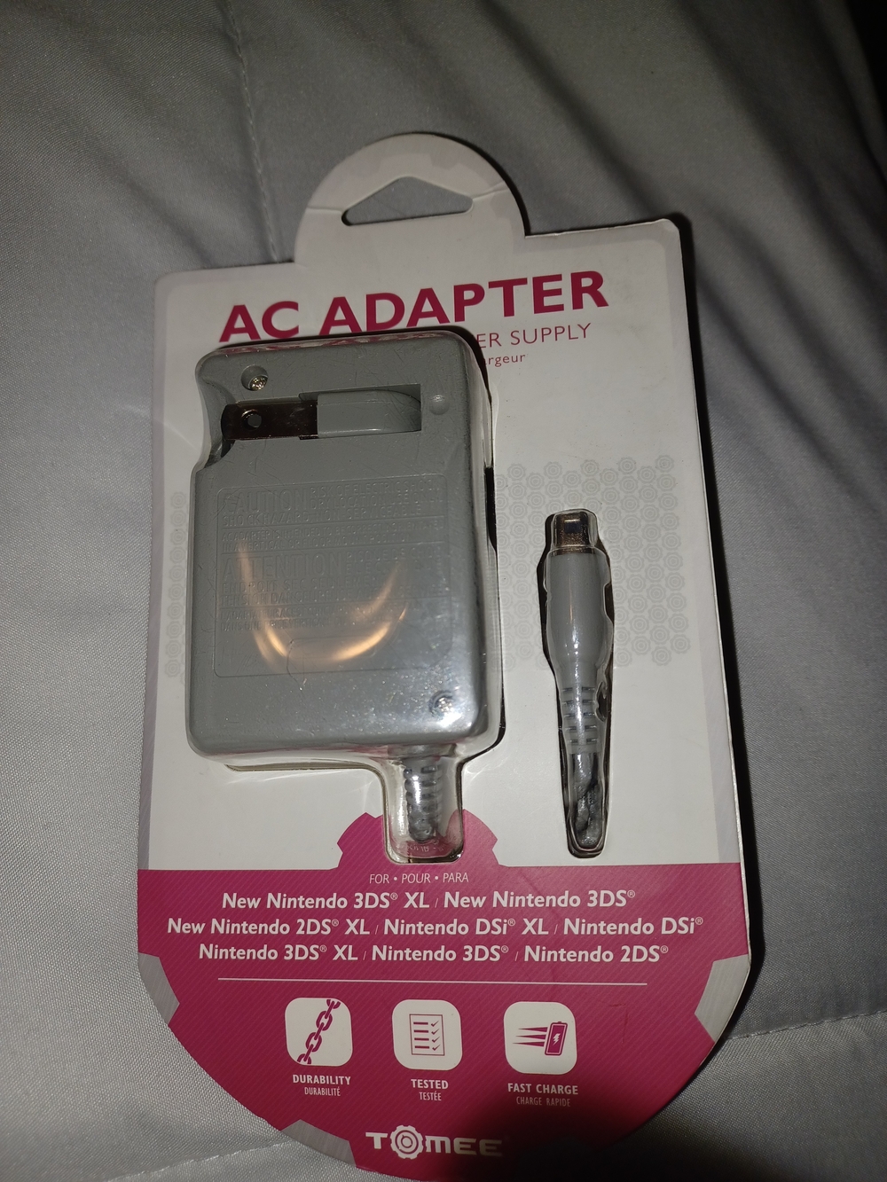 Tomee AC Adapter wall charger designed for Nintendo handheld consoles.